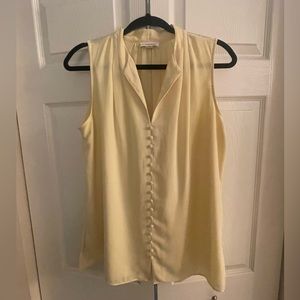 Calvin Klein sleeveless blouse. Size large color soft yellow.